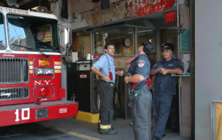 Ratating through photos of FD Ladder Co 10 WTC, Memorial WTC, Reconstruction of WTC, and WTC Fire Department.